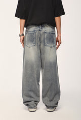 Jeans con agujeros lavados con agua de High Street Heavy Industry