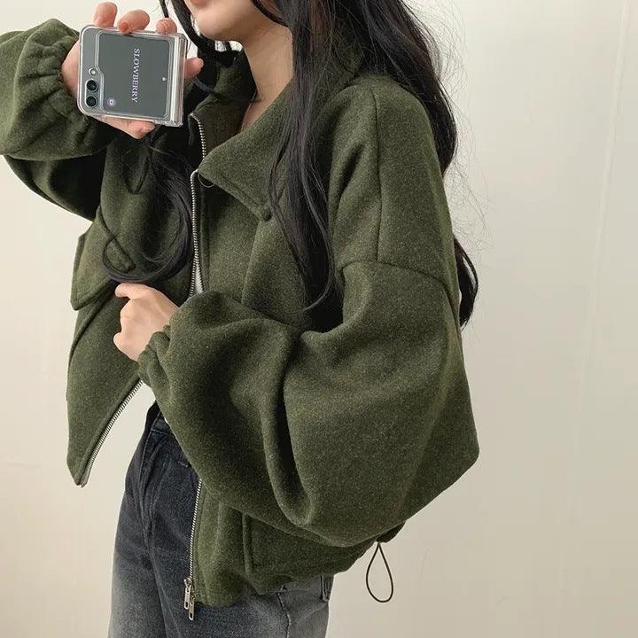 Army green short coat with zip front, lapel collar, drawstring hem, two front pockets