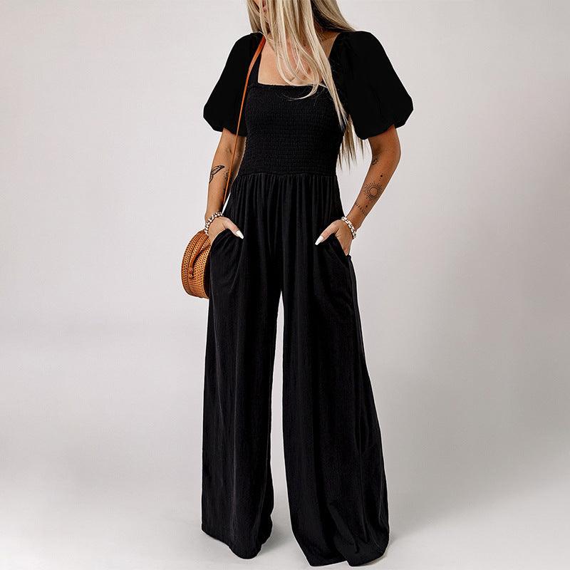 Black square-neck short-sleeve jumpsuit with smocked bodice and wide-leg pants