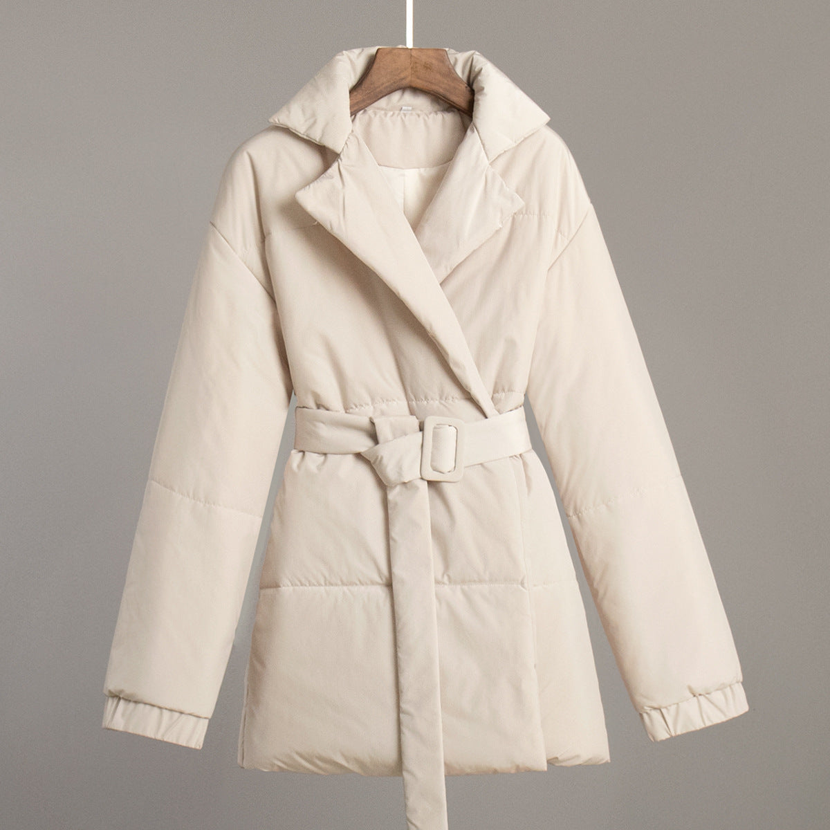 Solid color cotton coat with hood, belted waist, and quilted insulation in cream white