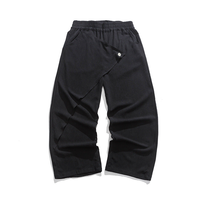 Black wide-leg cotton-linen trousers with elastic waist and diagonal wrap panel