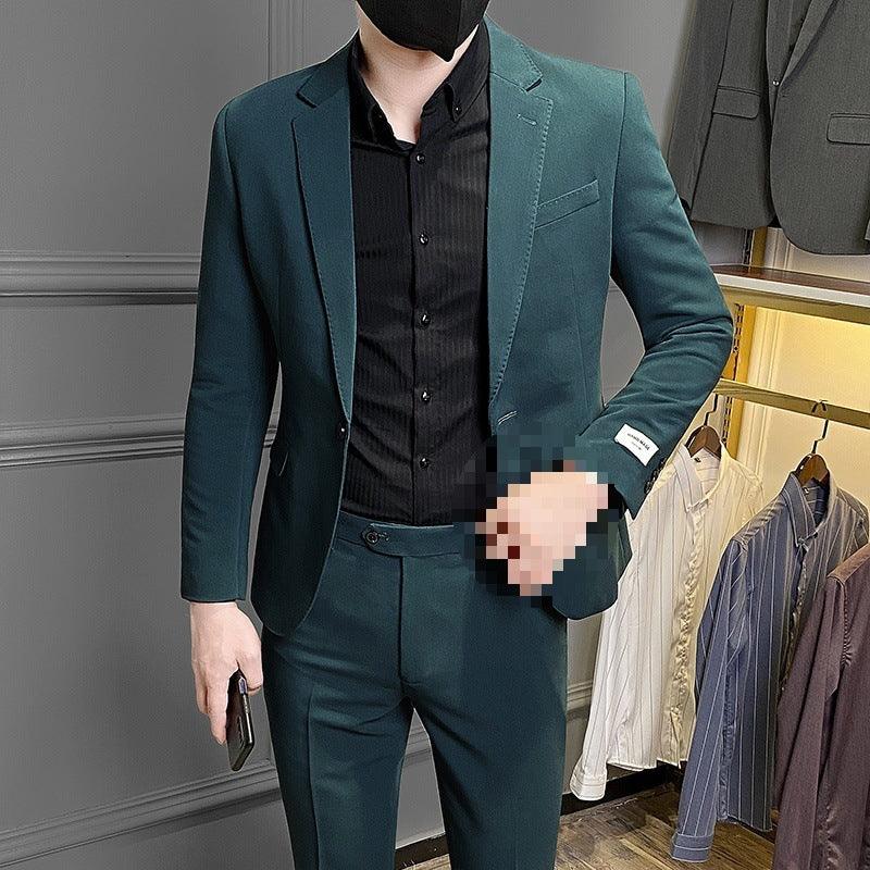 Men's slim-fit business suit, teal blazer and matching trousers with notch lapels.