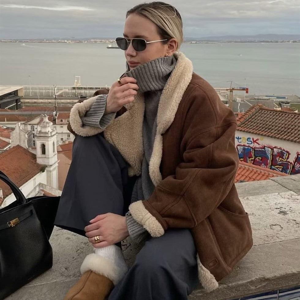 Caramel brown suede-style coat with cream sherpa collar, cuffs, and lining trim.