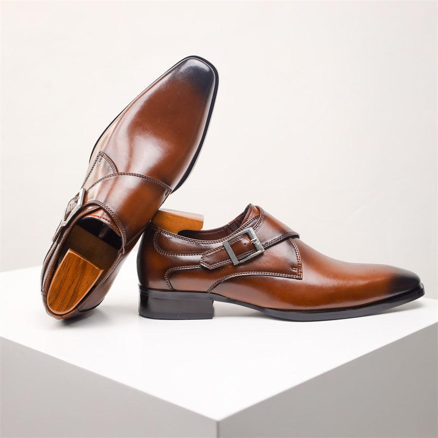 Men's brown leather dress shoes with side buckle strap and rounded toe.
