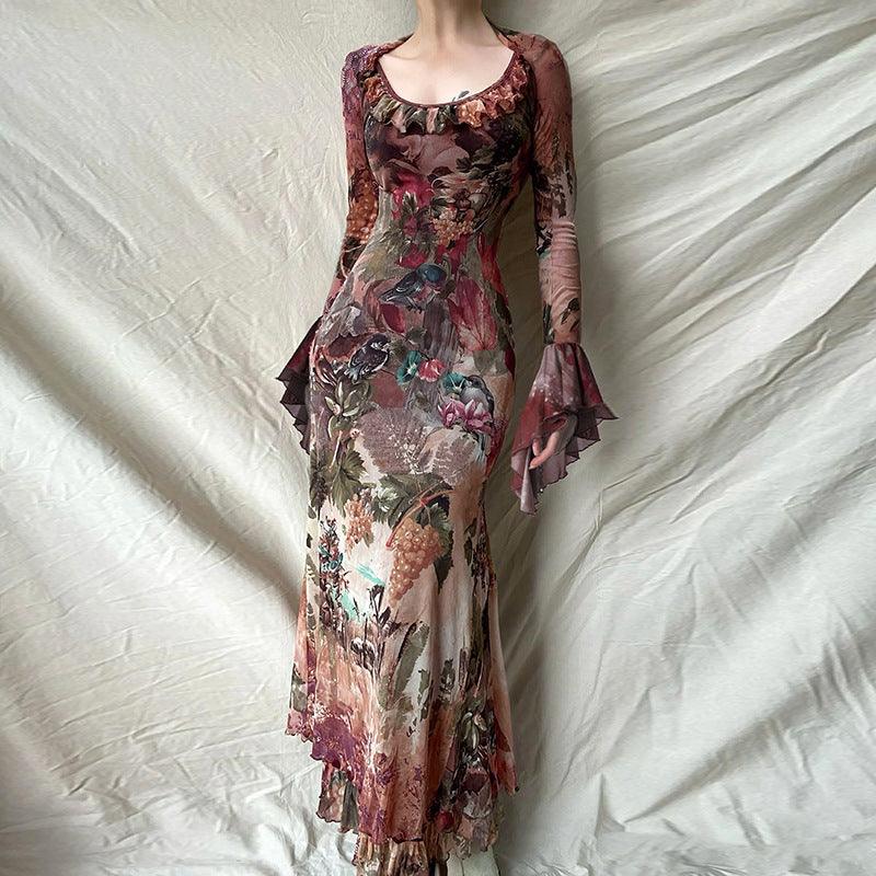 Floral ruffle trim dress with long sleeves, sheer look, fitted waist, maxi length.