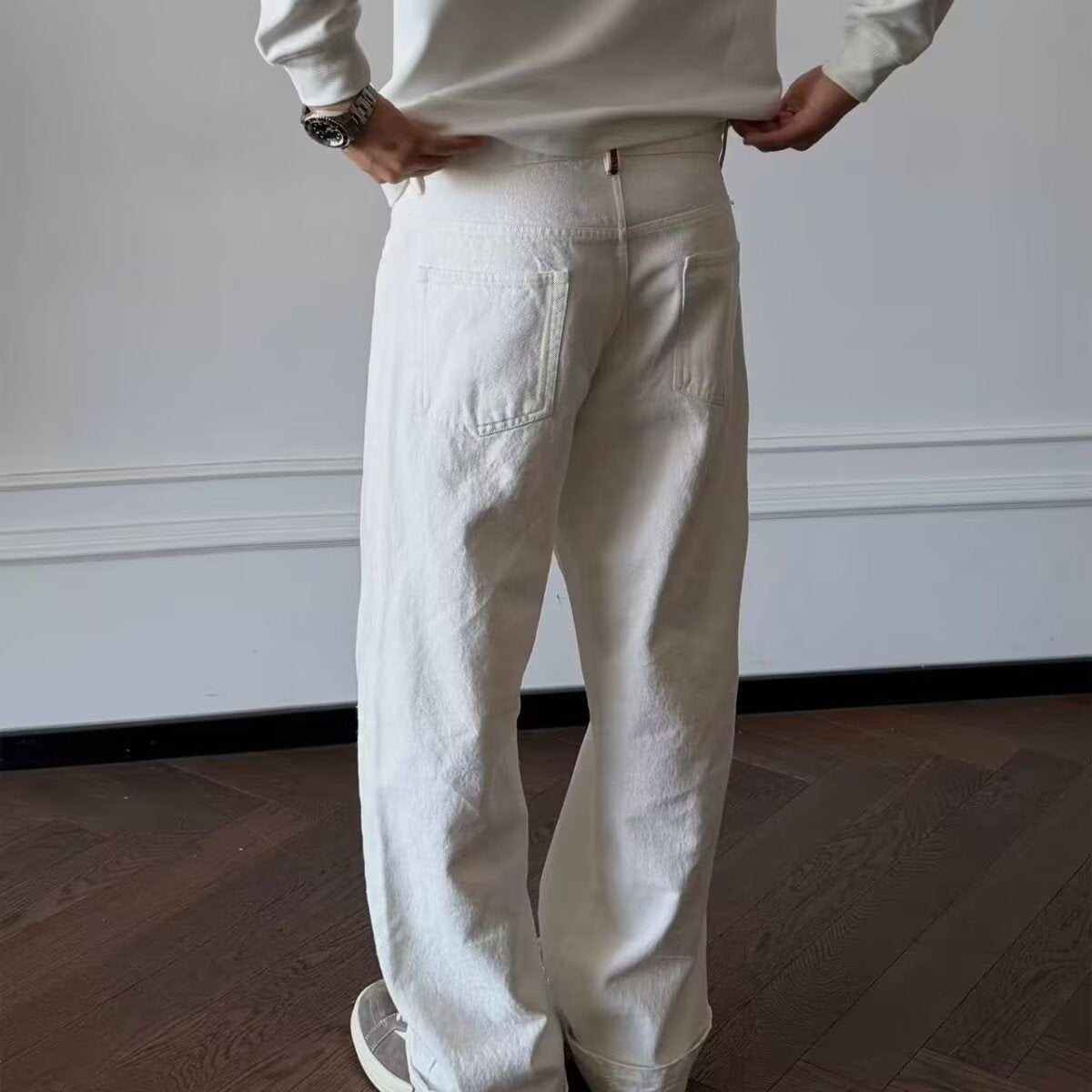 High-waisted straight-leg casual pants in off-white, loose fit with front seam details