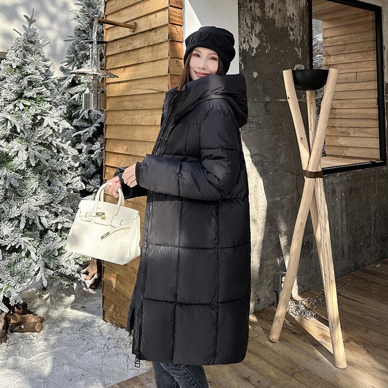 Long black hooded puffer coat with quilted panels and front zipper