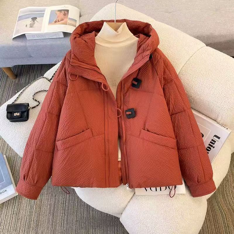 Rust-red hooded short puffer coat for women with front zipper and side flap pockets