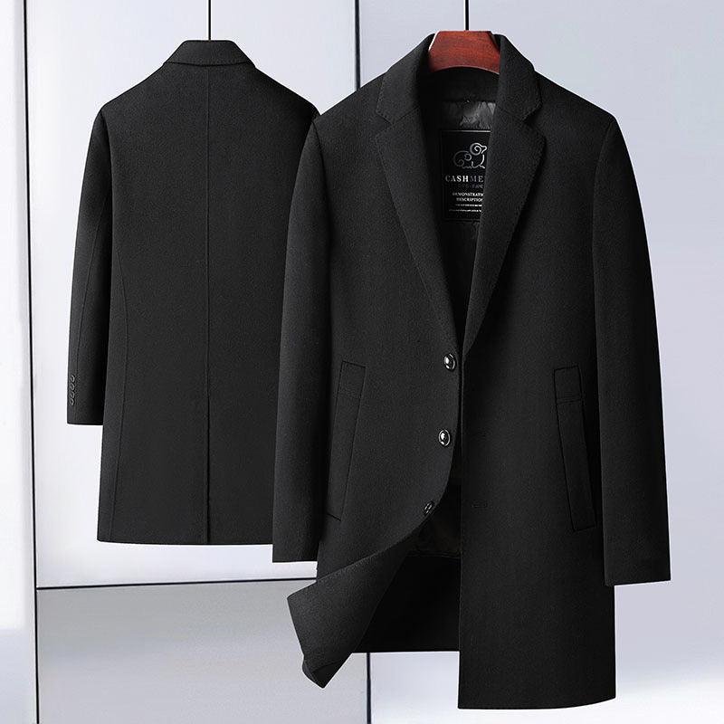 Black mid-length wool coat with notch lapels and detachable inner, folded open.