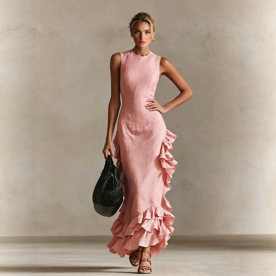 Pink sleeveless long dress with ruffled flounced hem and side ruffle detail