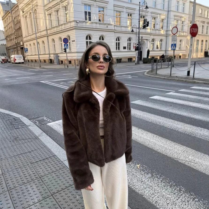 Dark brown fluffy faux fur jacket with pointed collar and front closure