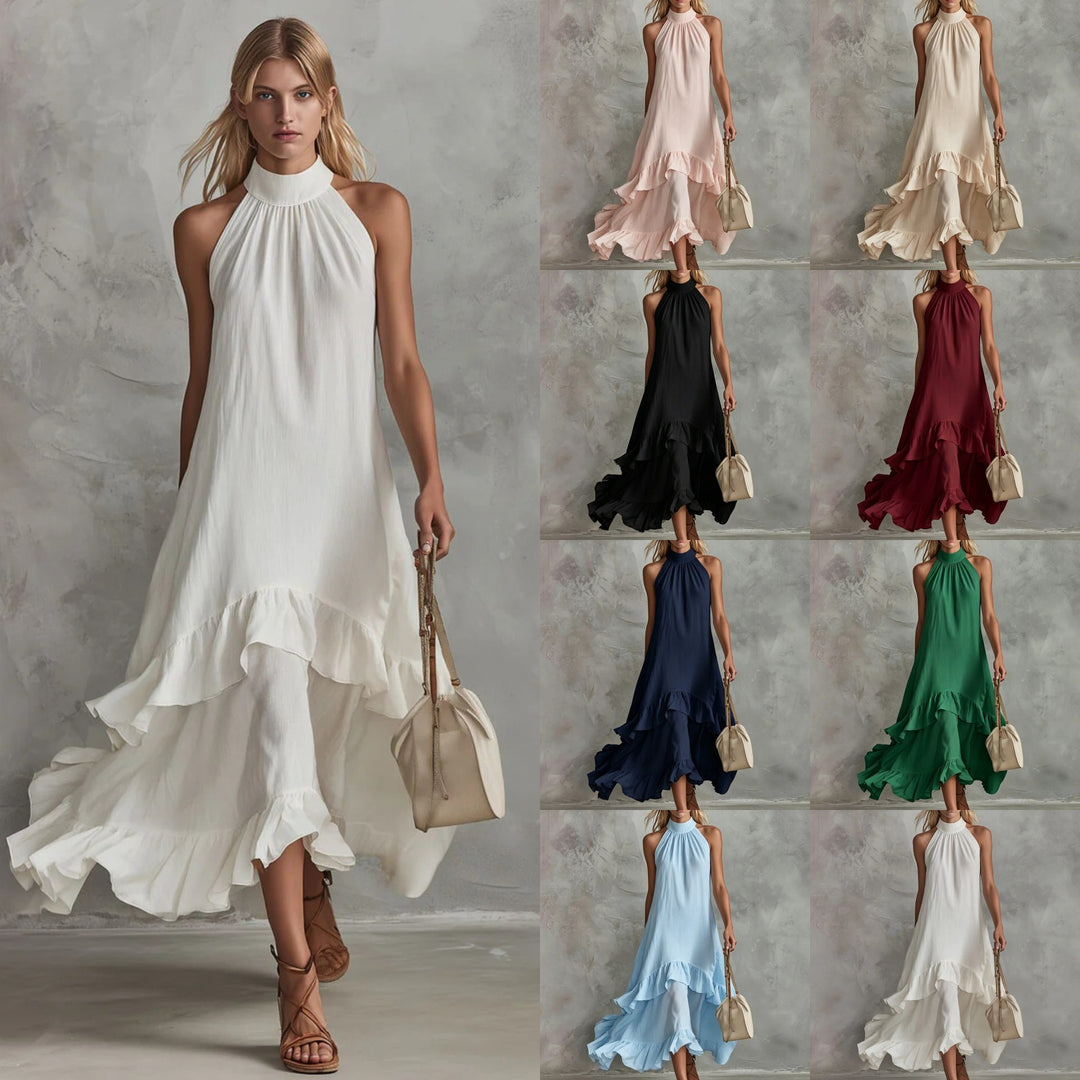 White sleeveless beach dress with high neck and layered ruffle hem