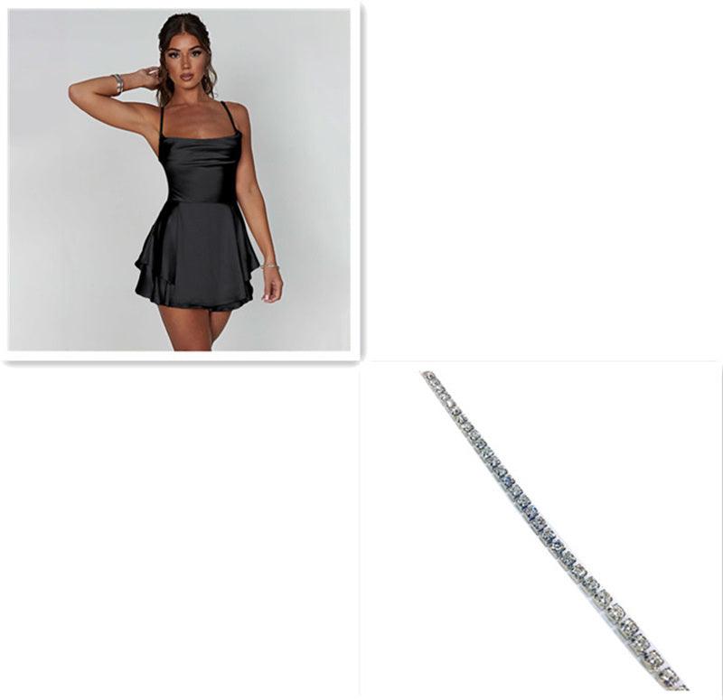 Black satin suspender-style mini skirt with spaghetti straps and flared hem