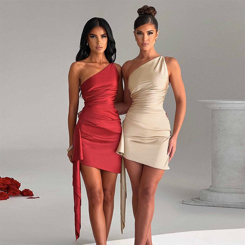 One-shoulder mini dress pair: red and light beige satin, draped bodice, sleeveless mini