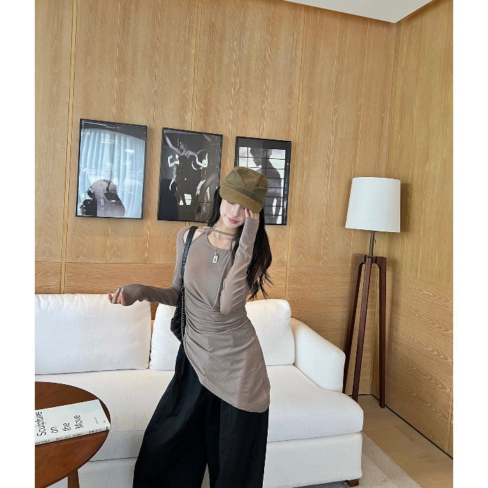 Women's gray halter-neck long-sleeve draped T-shirt, worn with black shorts
