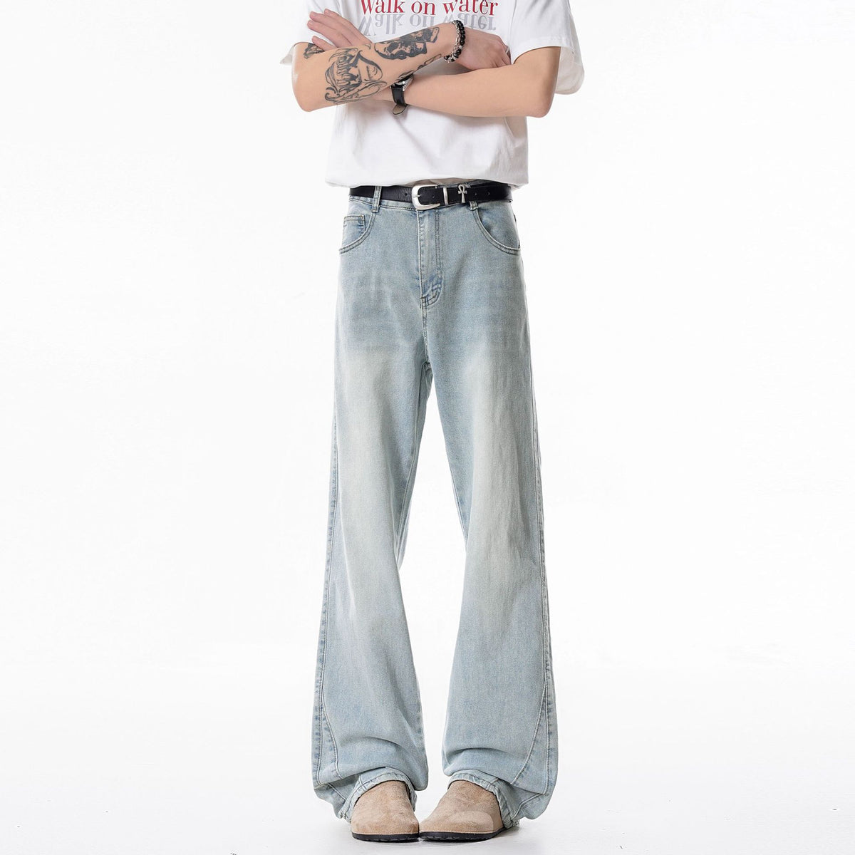 Light blue men's straight-leg jeans with button fly and relaxed waist