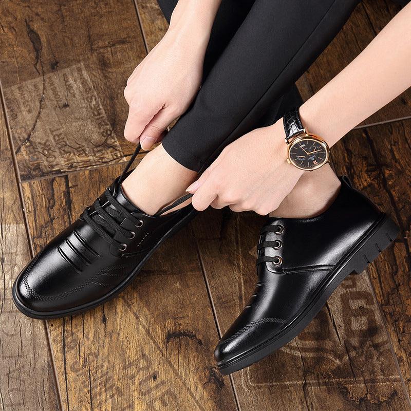 Black leather lace-up oxford shoes with perforated detailing and low-profile sole