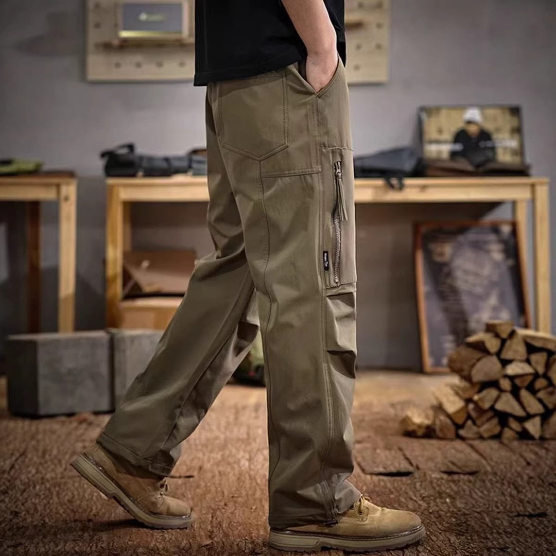 Army green paratrooper cargo trousers with side zip pocket and utility cargo panels
