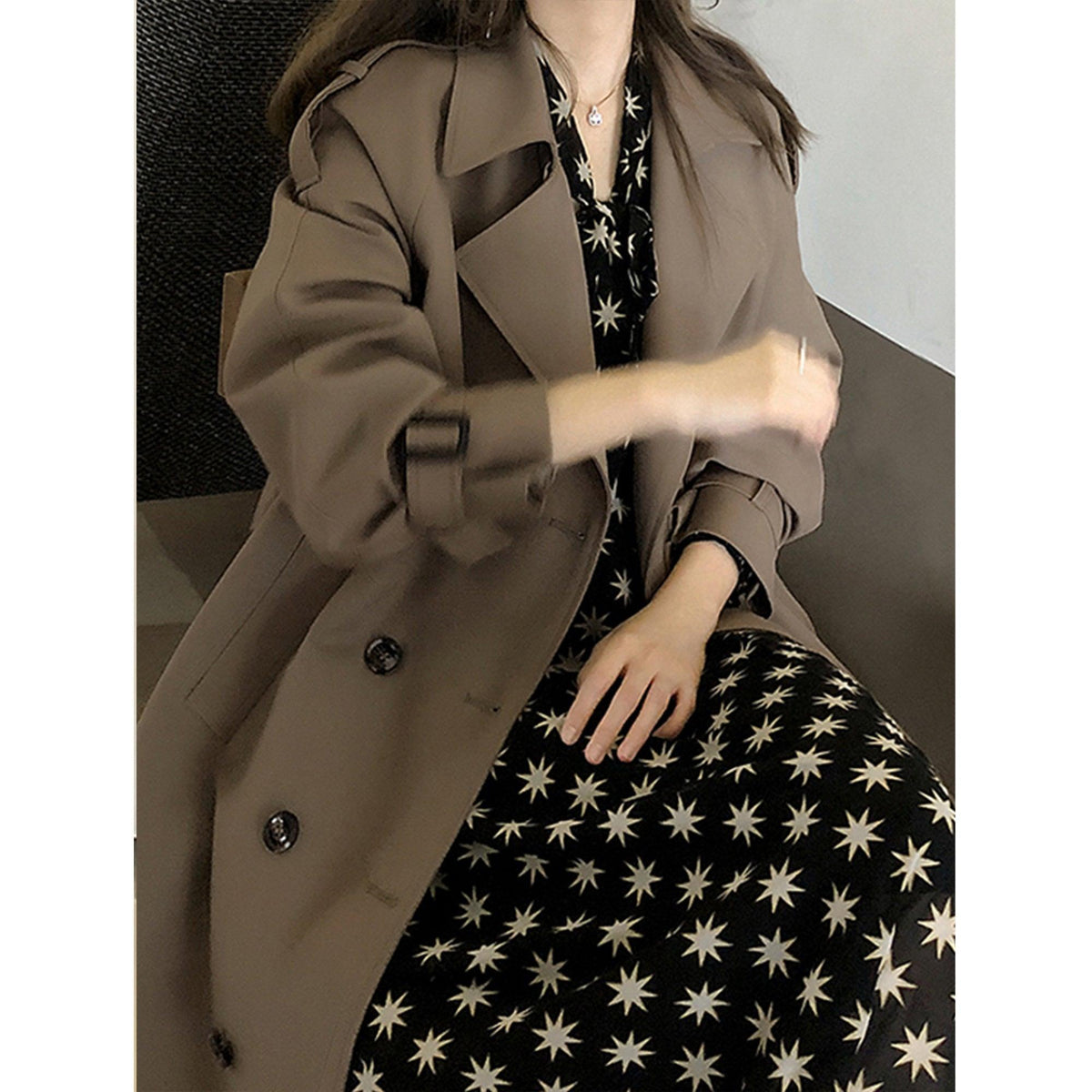 Women’s taupe trench coat with double-breasted buttons and belted waist detail