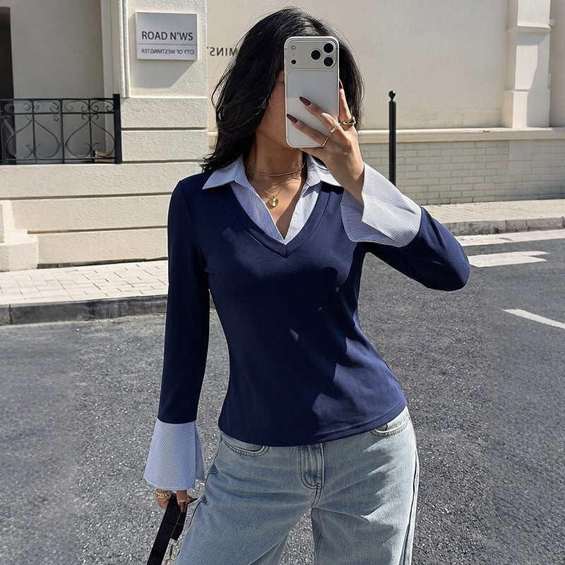 Women’s fitted V-neck top in dark blue with light blue contrast collar and cuffs