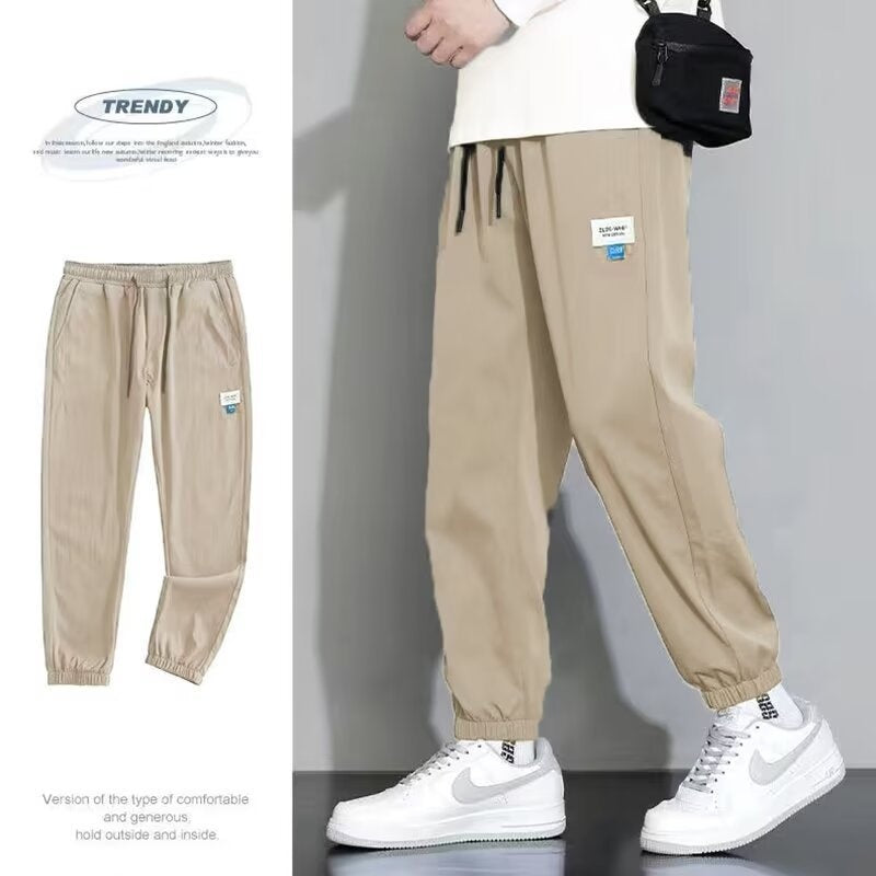 Khaki draping sports jogger pants with elastic ankle cuffs and drawstring waist