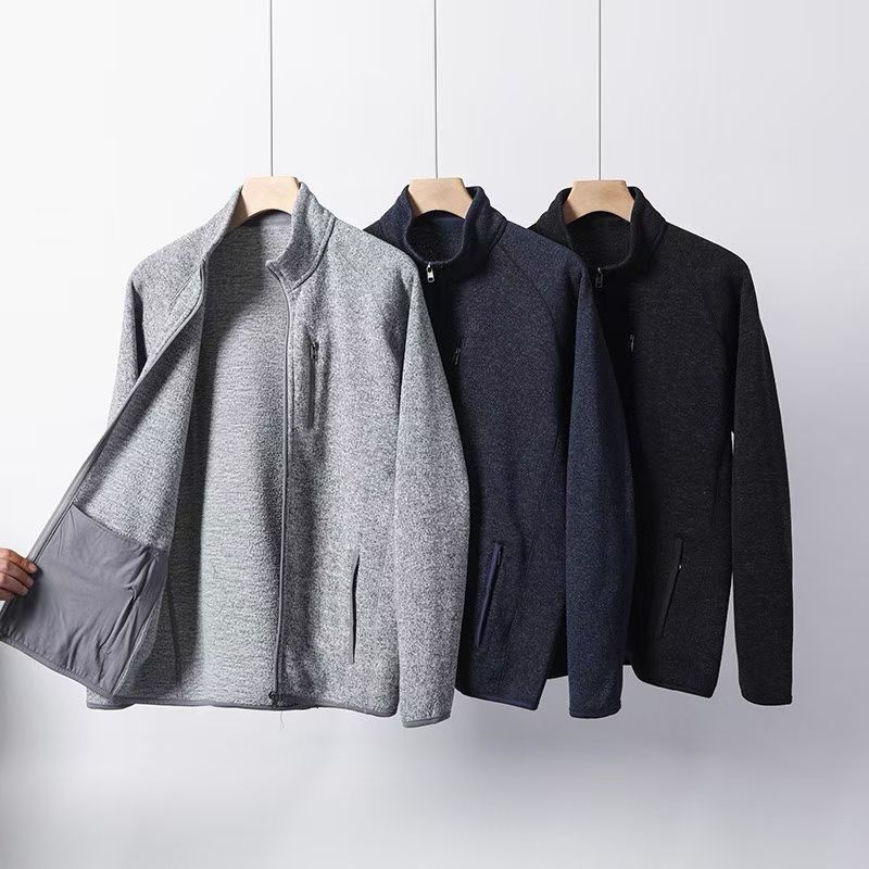Men's knit fleece zip jacket in gray, navy, and black, standing collar on hangers