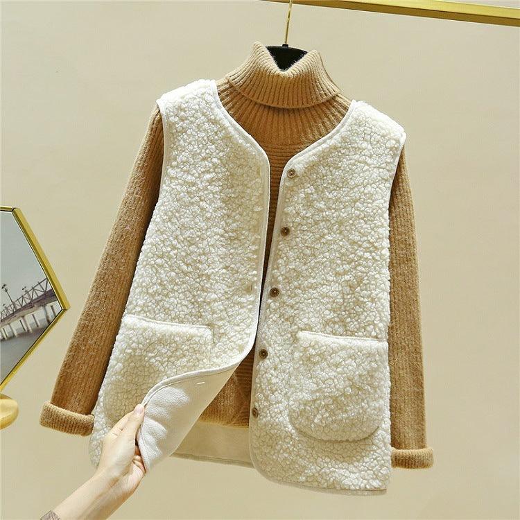 Beige sleeveless plush fur vest with snap front and two front pockets