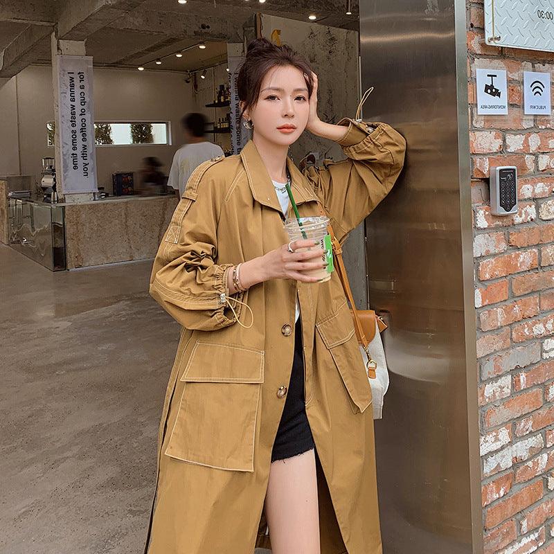 Khaki windbreaker jacket with drawstring waist and front pockets