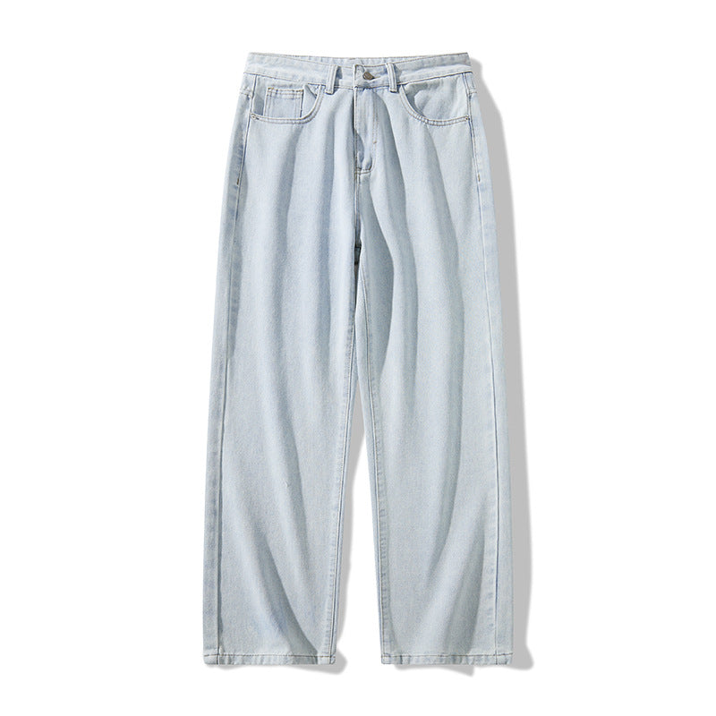 Light wash blue wide-leg denim trousers with relaxed fit and front button closure