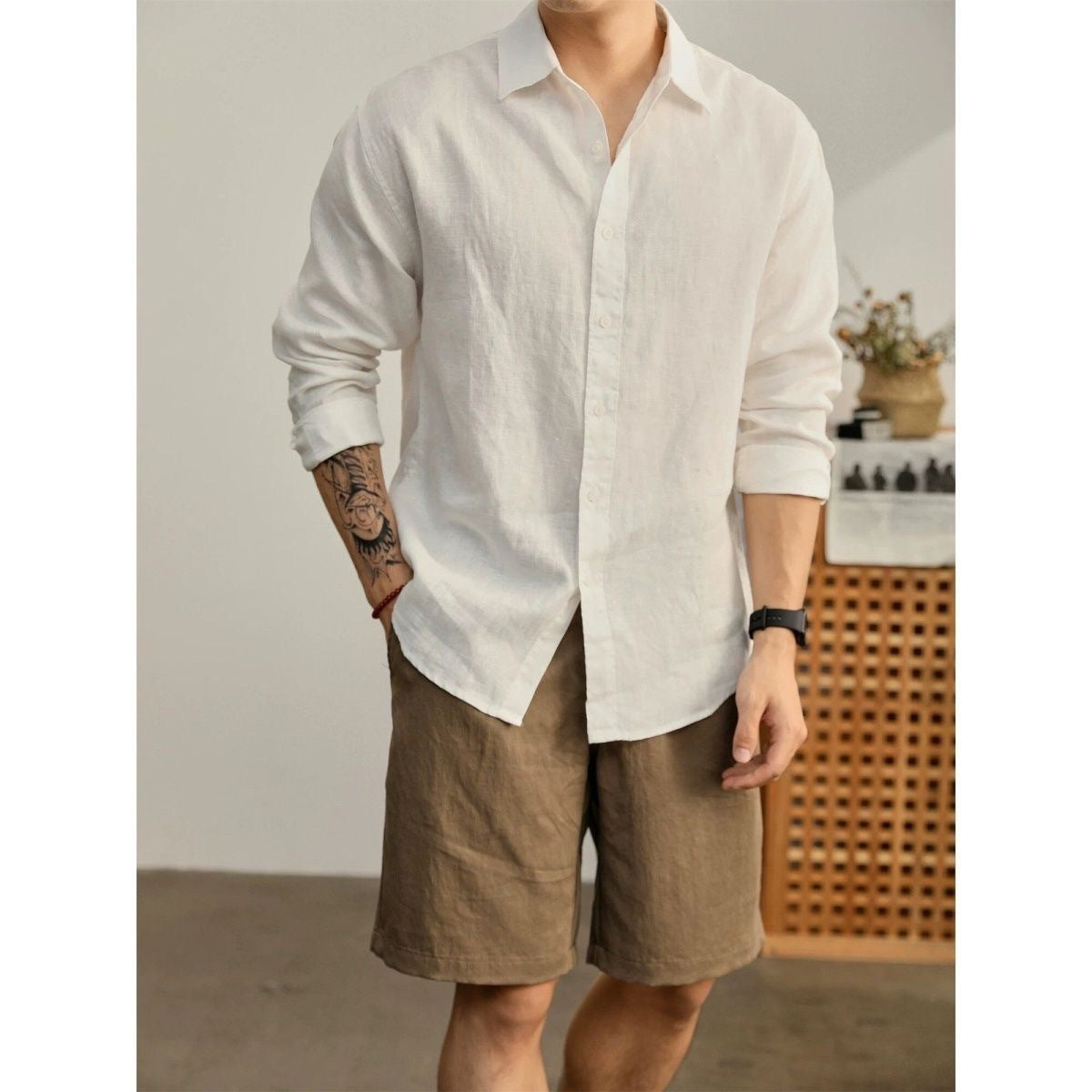 White long-sleeve button-up shirt, slim fit, point collar, button front.