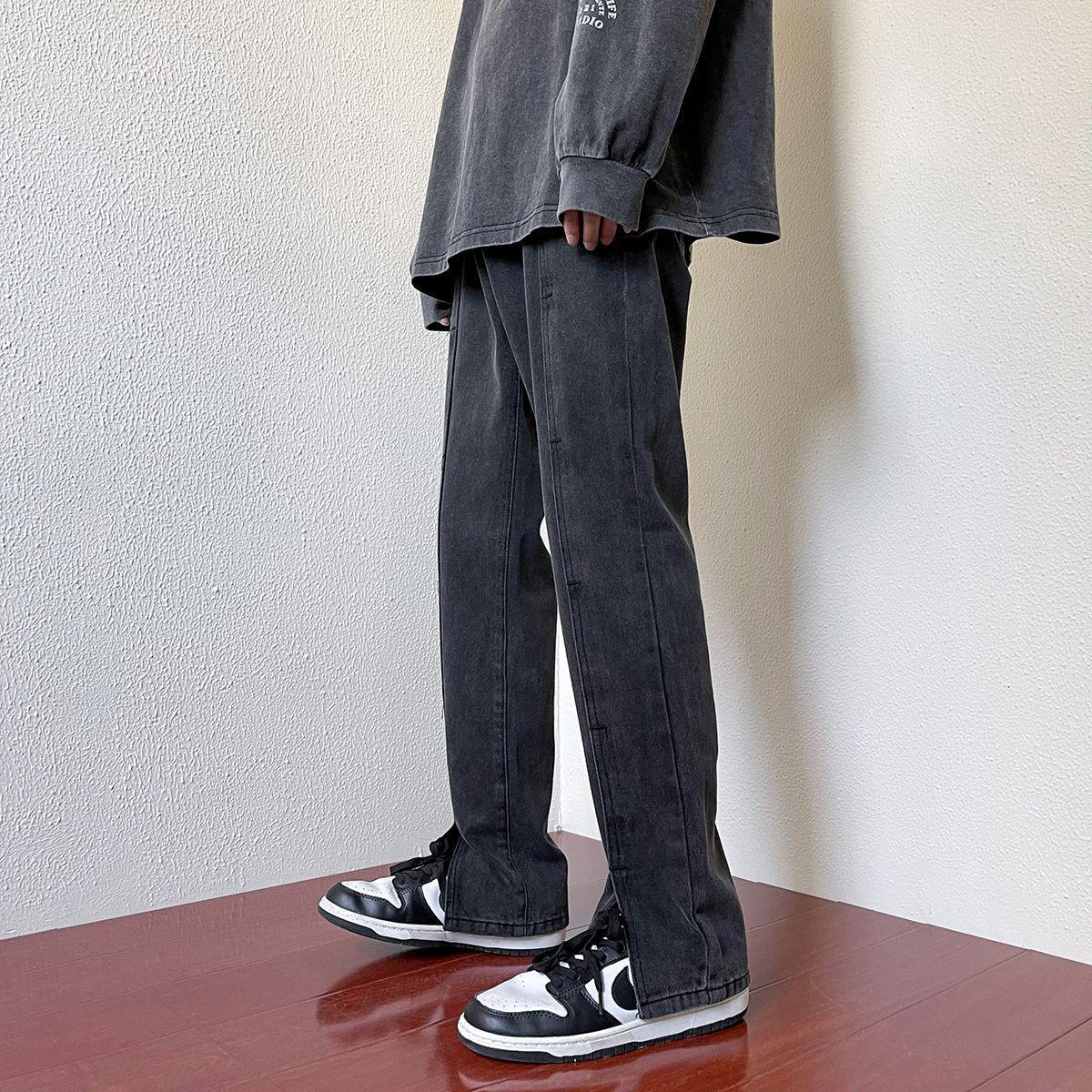 Dark wash straight-leg denim jeans with stitched seams and relaxed fit