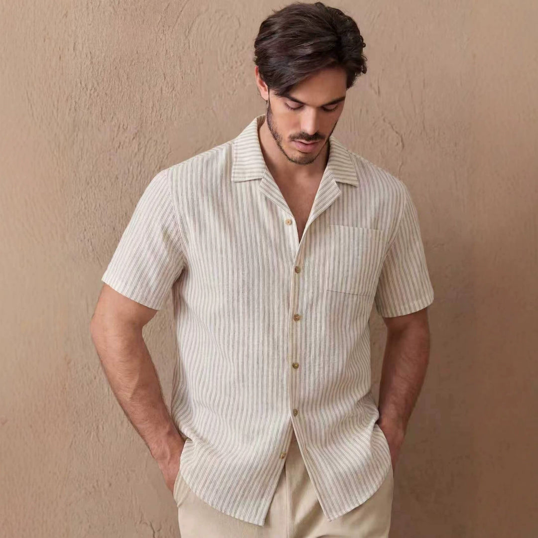 Men's beige short-sleeve button-up shirt with vertical pinstripes and spread collar