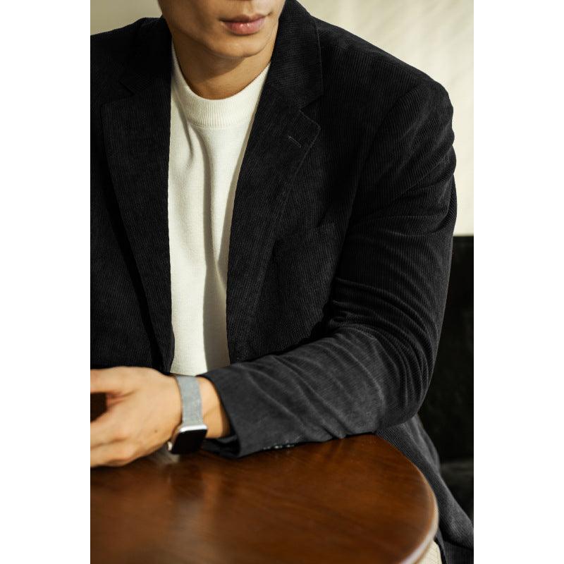 Black slim-fit blazer with notched lapels and button front, side view