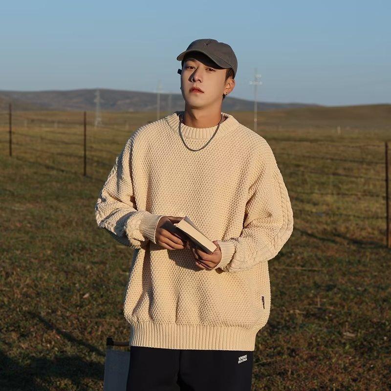Apricot knit sweater with crew neck and ribbed cuffs