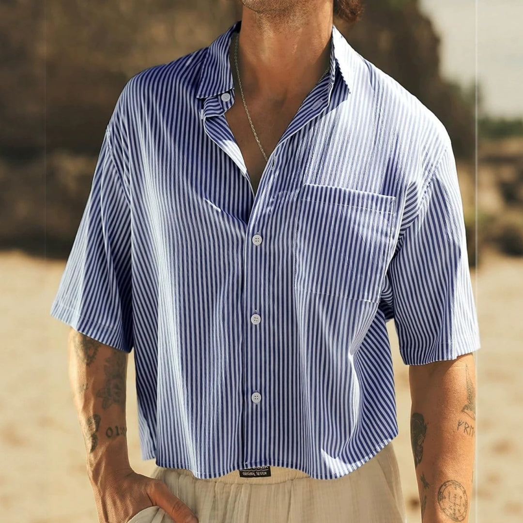 Light blue striped short-sleeve button-up top with chest pocket and open collar