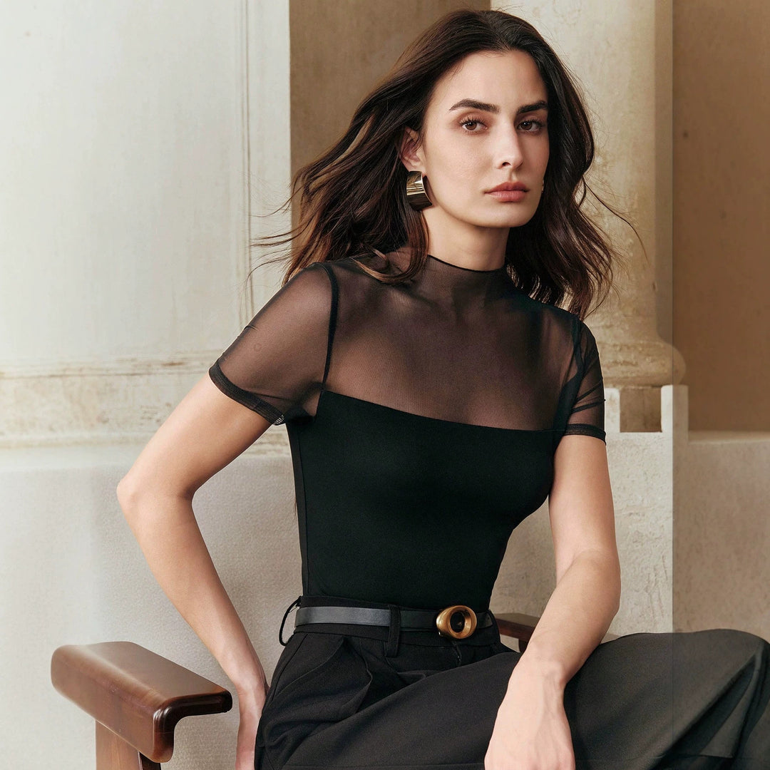 Sheer mesh short-sleeve top in black with high neckline and fitted patchwork panels