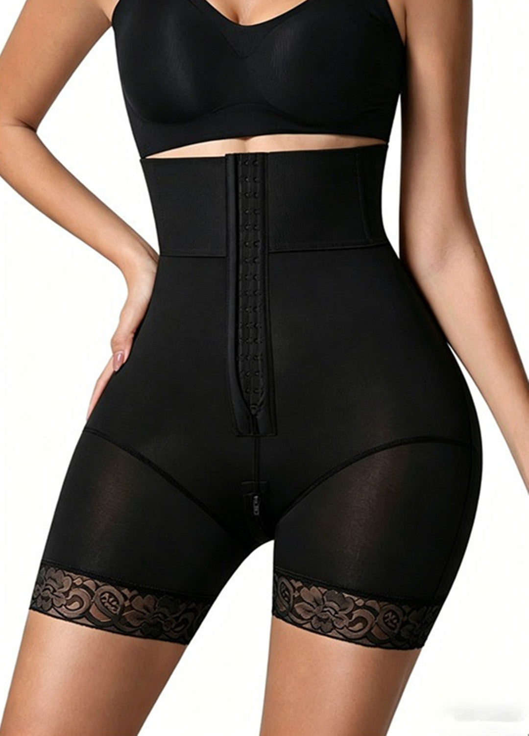 Black high-waist shapewear shorts with lace-trim leg openings and front closure panel