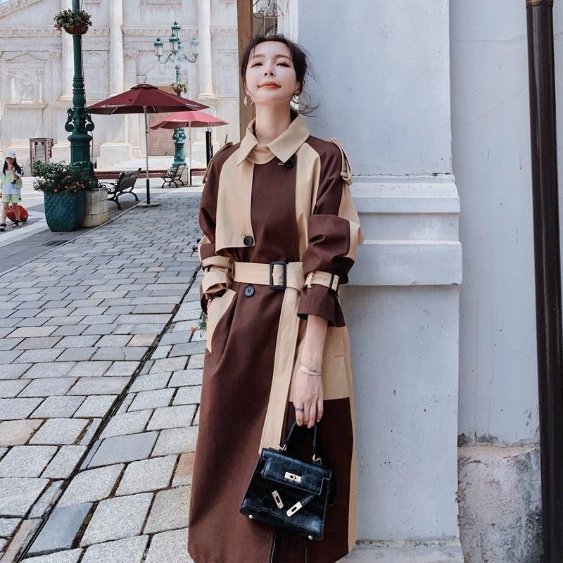 Long trench jacket, button-front with waist belt, khaki collar and dark brown body.