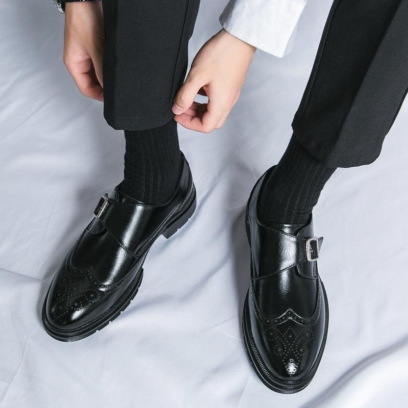 Black leather loafer shoes with buckle strap and perforated detailing