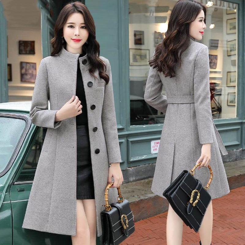 Women’s gray wool coat with high collar, button front, and long sleeves