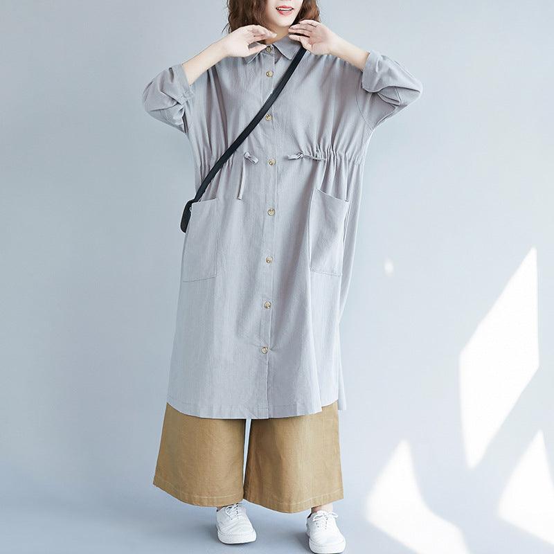 Grey long button-up shirt with collared neckline, front buttons, and patch pockets