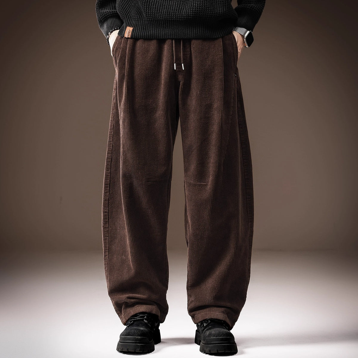 Brown flannel straight-leg pants with drawstring waist and vertical front seams