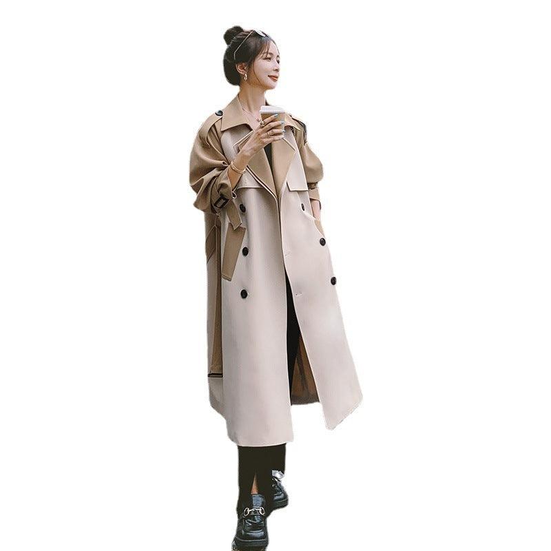 Khaki mid-length trench coat with stand collar, buttoned placket, and belt tie