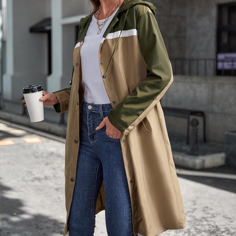 Long hooded windbreaker jacket with olive and khaki colorblock panels and snap buttons