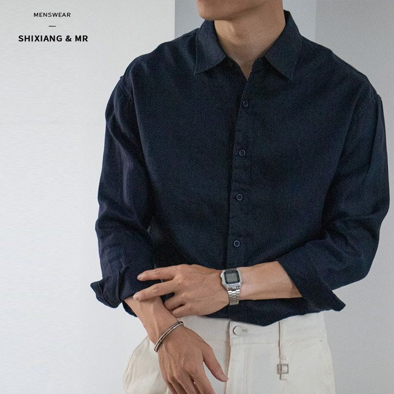 Dark blue long-sleeve button-up mens shirt with pointed collar, slim fit