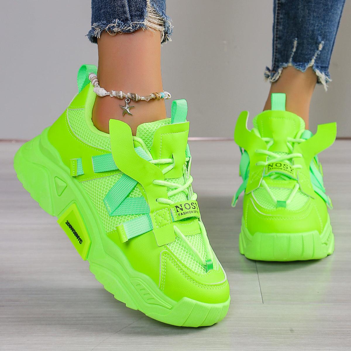 Neon green women's platform mesh dad shoes with lace-up straps and grippy platform sole