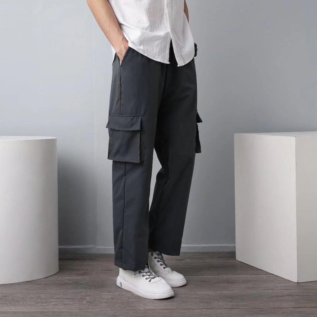 Men's dark gray cargo pants with side flap cargo pockets and straight legs