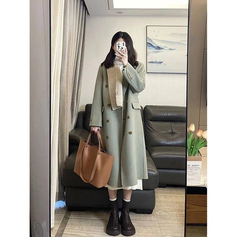 Women’s matcha green long wool coat, double-breasted with gold buttons and flap pockets