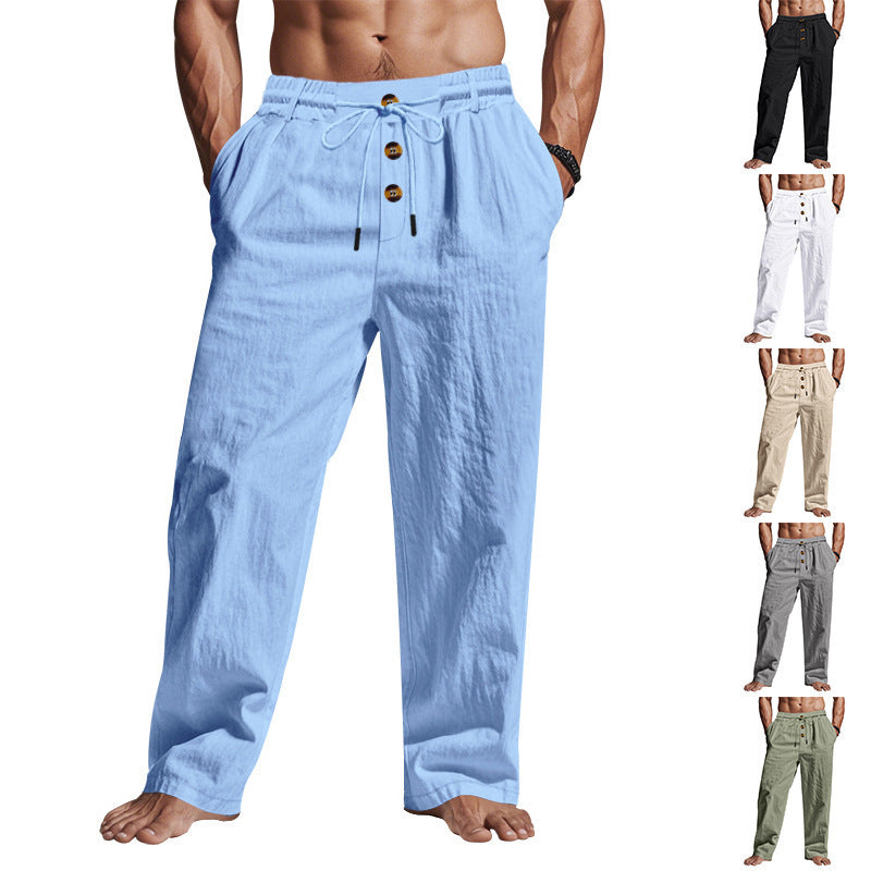 Men's light blue linen trousers with drawstring waist and button front, loose fit