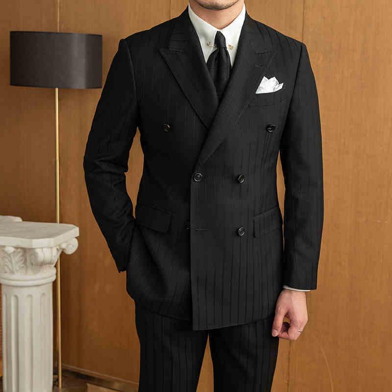 Black double-breasted striped suit set with matching vest and trousers, full-length view
